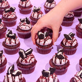 Vegan Red Velvet Volcano Cupcakes topped with Oreo cookie icing and plant-based ganache by Crumbs & Doilies.